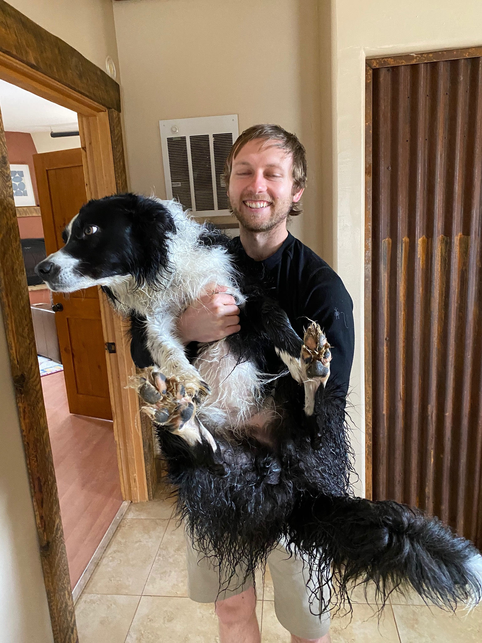 It was mud season in Dolores, which meant Skutull got lots of baths! This is me carrying him to the bathtub so he doesn't get the house muddy.