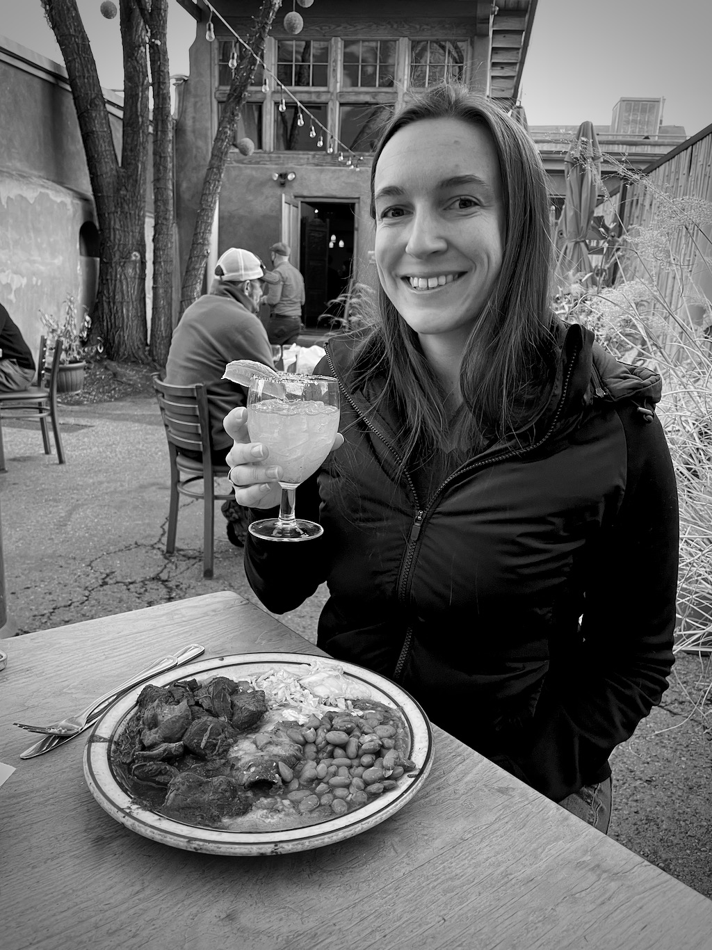 Shelby enjoying a margarita and some fresh, spicy food.
