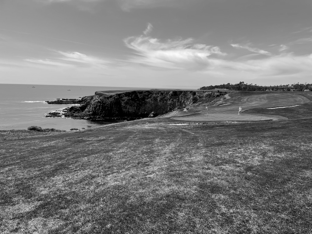 Looking back on hole 8. This is often referred to as the best second shot in golf. Your first shot (ideally) lands at the edge of the cliff way off in the distance. Then you hit your second shot across the ocean and (ideally) onto the green.